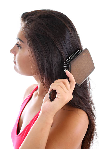 istock young woman brushing her hair 119567441
