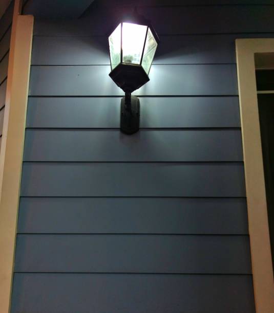 istock Lamppost over wooden house, concept background ideal for adding text 1195675030