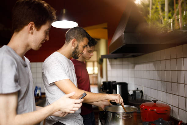 istock Friends cooking together 1195676787