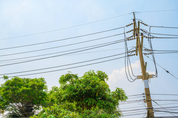 istock Electricity concept. Close up high voltage power lines station. 1195679051