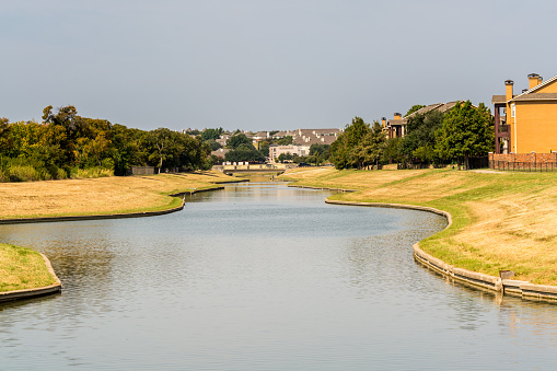 A river passing through the residential eara in uptown of Dallas Fort Worth, Texas, USA.
