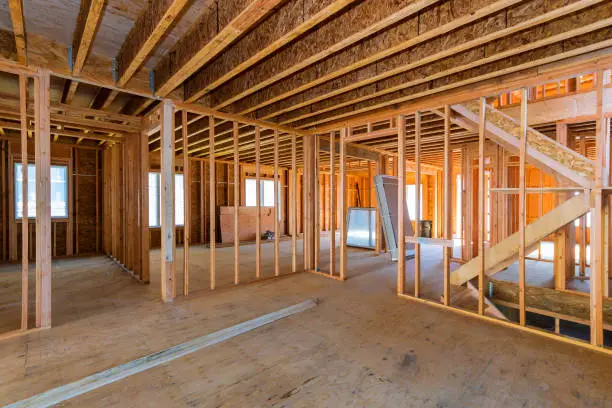 Interior view of a house under construction home framing