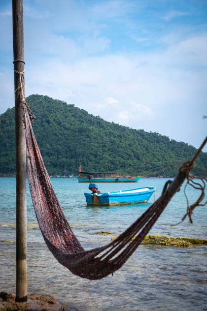 istock The Blue Boat and the Rope Hammock 1195689390