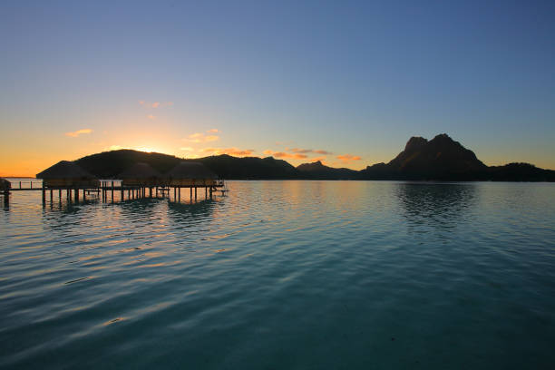 istock Sunrise over Bora Bora lagoon 1195691075