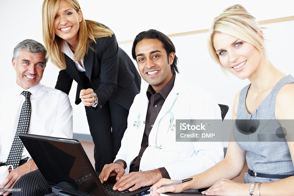 happy multiracial business team working on laptop with Doctor  Healthcare And Medicine Stock Photo