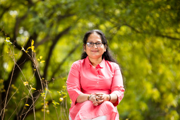 istock Happy mature woman at park 1195692649