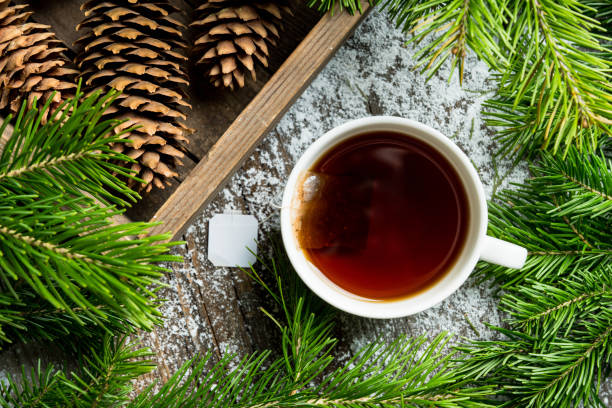 Cup of tea with forest decorations Cup of tea with forest decorations. Selective focus. Shallow depth of field. pine needle tea stock pictures, royalty-free photos & images