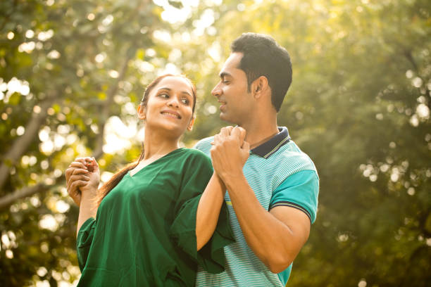 istock Indian couple embracing at park 1195694482
