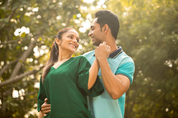 istock Indian couple embracing at park 1195694991