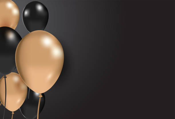 istock Black and gold balloons on a black background. Celebration concept. Festive background 1195696091