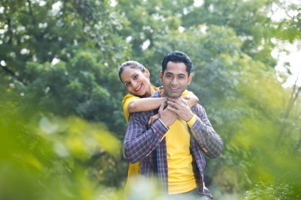istock Loving couple enjoying at park 1195696863