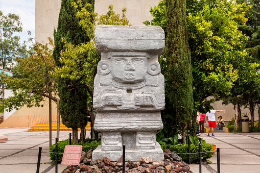 A stone statue at the  ruins of the architecturally significant Mesoamerican pyramids  located at at Teotihuacan, an ancient Mesoamerican city located in a sub-valley of the Valley of Mexico