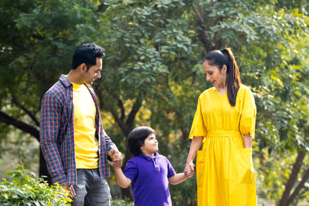 istock Happy family at park 1195697052