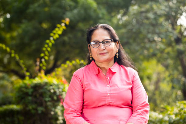 istock Happy mature woman at park 1195697712