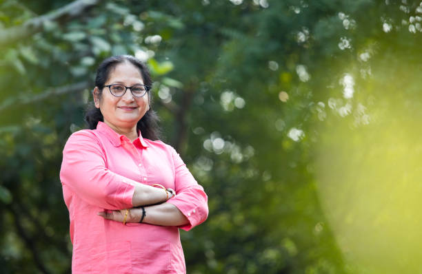 istock Happy mature woman at park 1195697728