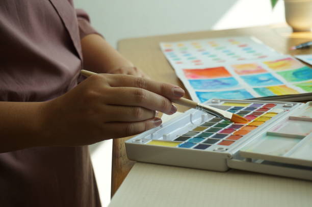 istock Watercolor paints and brushes workplace artist with artistic tools for mock up.Creative Design Concept. 1195701615
