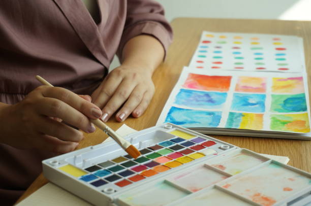 istock Watercolor paints and brushes workplace artist with artistic tools for mock up.Creative Design Concept. 1195701619