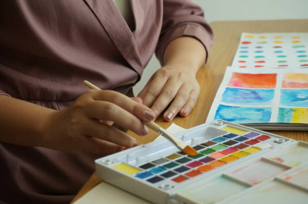 istock Watercolor paints and brushes workplace artist with artistic tools for mock up.Creative Design Concept. 1195701622