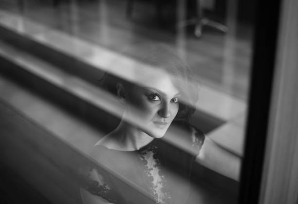 istock Woman is looking so deeply. Sun is shinning. 1195704983