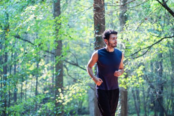istock Jogger exercising in the park 1195706812