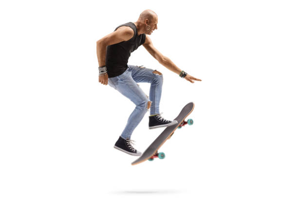 istock Male skateboarder jumping with a skateboard 1195706981