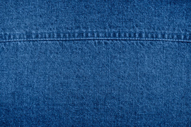 istock Blue jeans background with seam close up. Top View. Blank Jeans Backdrop or Banner. 1195712430