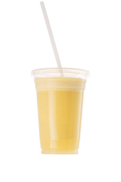 istock Fresh Fruit Smoothie Shake in a plastic cup and straw isolated on white background 1195713618