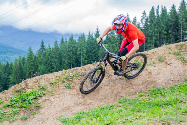 istock Professional cyclist riding a mountain bike, downhill. 1195715312