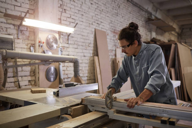 istock Carpenter making furniture in workshop 1195718498