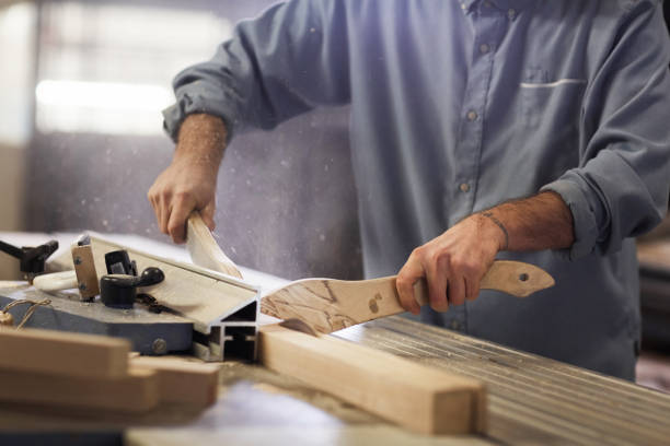 istock Carpenter making wooden details 1195719106