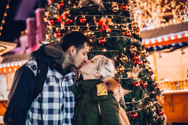 istock Young couple having Christmas fun 1195720253