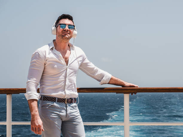 istock Man on the empty deck of a cruise liner 1195721238