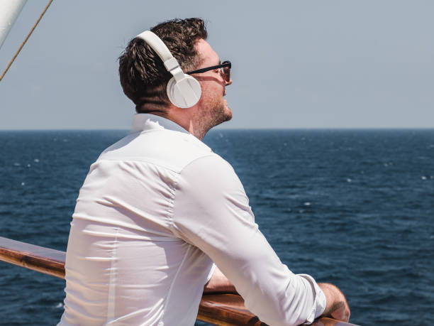 istock Man on the empty deck of a cruise liner 1195721278