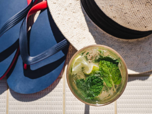 istock Beautiful glass with refreshing mojito and ice cubes 1195721328