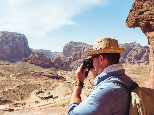 istock Tourist with a vintage camera. Petra, Jordan. 1195721605