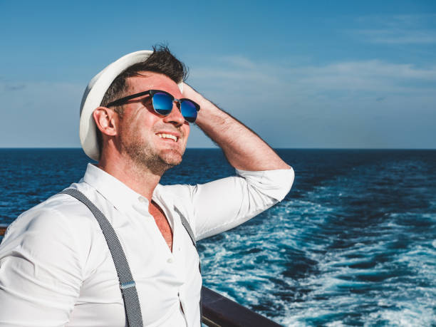 istock Smiling man on the empty deck of a liner 1195721829