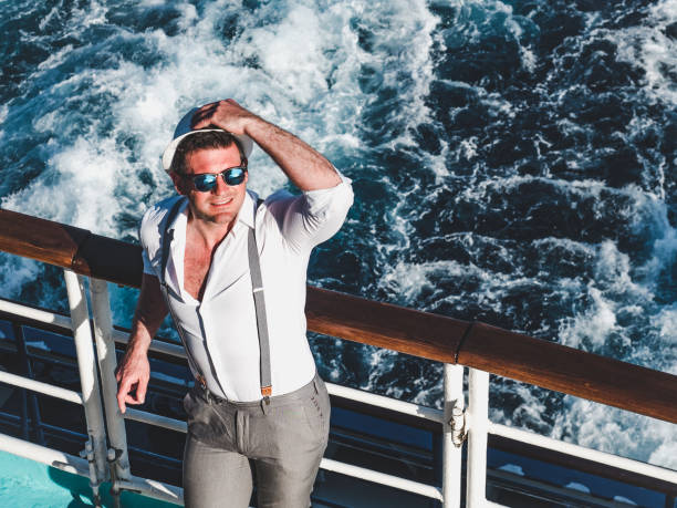 istock Smiling man on the empty deck of a liner 1195722423