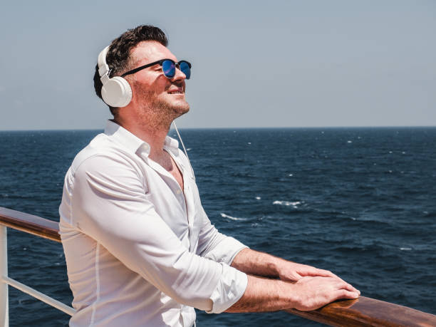 istock Man on the empty deck of a cruise liner 1195722447