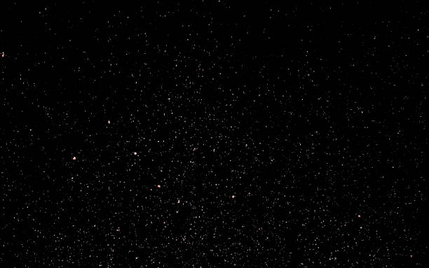 istock Abstract background with shiny sparkling snowflakes. Particles of colored dust sparkles. 1195724611