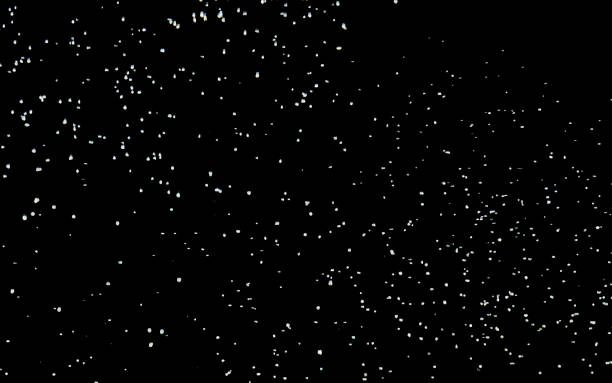 istock Snowfall background. White snow on a black sky. Winter background. 1195724619