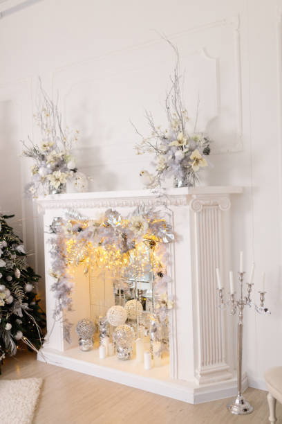 istock Beautiful Christmas Decorations On The Fireplace 1195725091