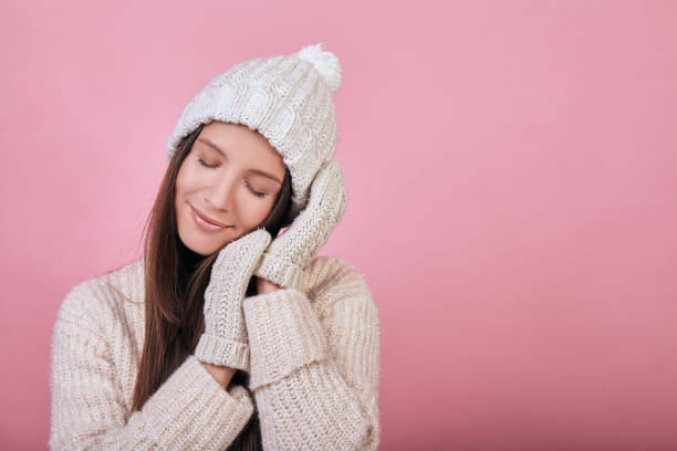 istock Cute girl sleeping on her hands in mittens 1195726045