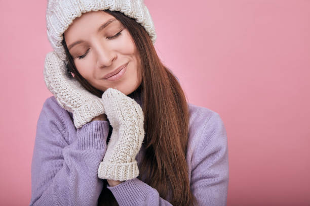 istock Tender girl with closed eyes and folded hands under her cheek 1195726417