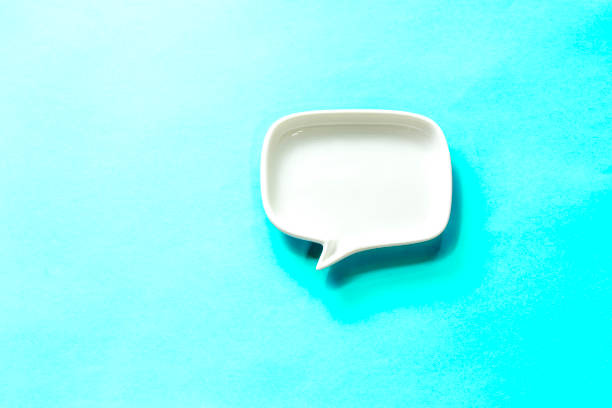 istock white Blank dialog speech bubble Isolated on sky blue Background 1195727164