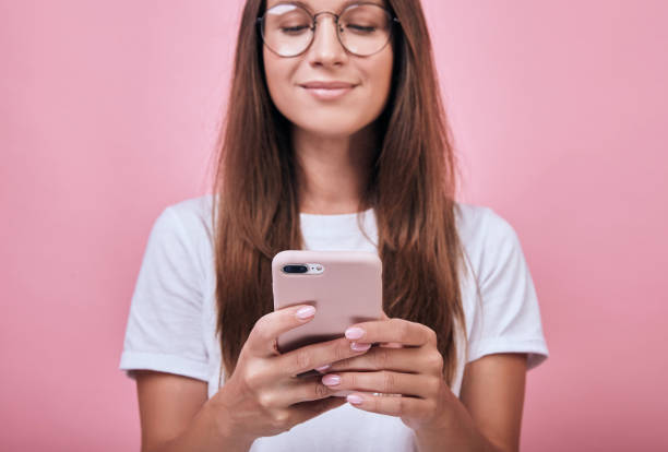 istock Cute funny charming girl typing a message 1195728294