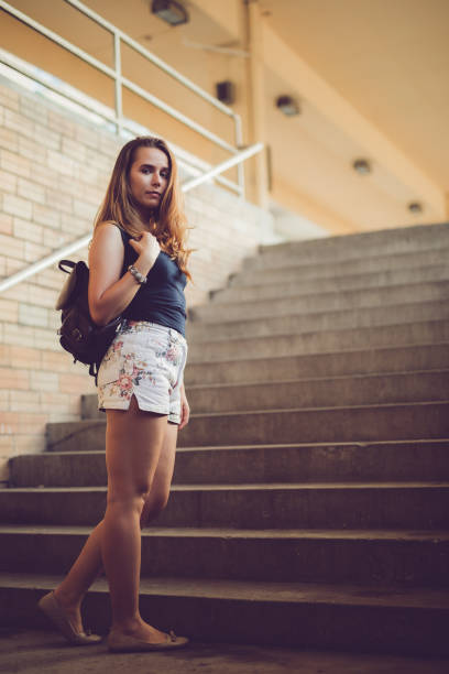 istock Woman at the train station 1195729339