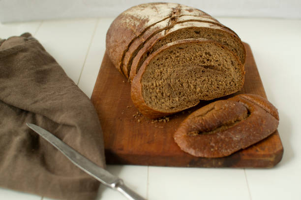 istock Freshly baked bread on a cutting board 1195729460