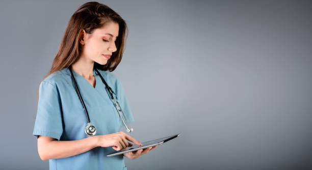 istock Female doctor doing checkup with tablet 1195731443
