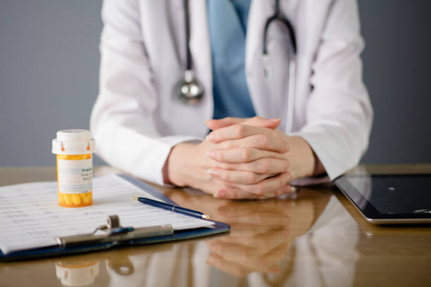 istock Doctor with pill bottle 1195731553