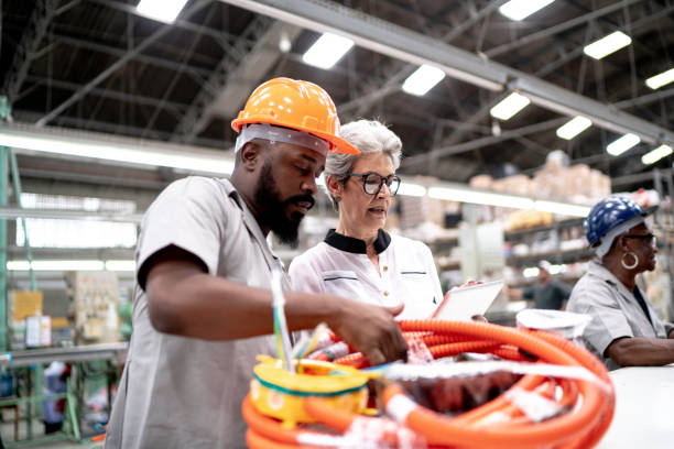 istock An engineer and a manager working together in a factory 1195732109